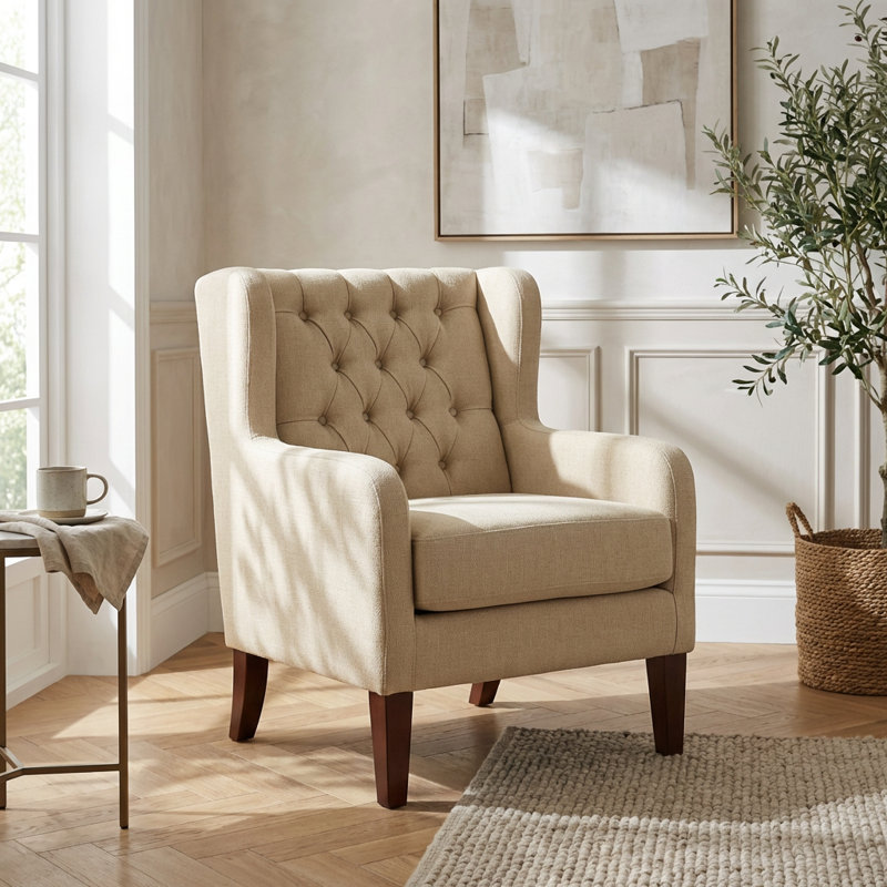 Fauteuil à oreilles classique avec rembourrage capitonné et pieds en bois massif