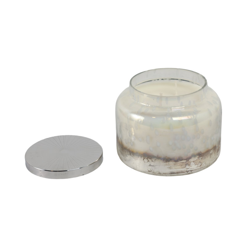 Bougie décorative en cire de verre dans un contenant à couvercle en métal avec un style moderne Boho Glam et un design élégant et irisé