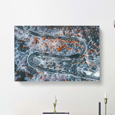 Road Curves Through A Forest - Wrapped Canvas Print