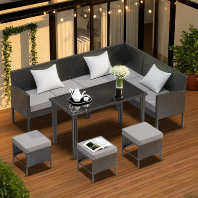 Ensemble de salle à manger 7 pièces avec coussins amovibles, chaises en osier durable et table basse en verre trempé pour le jardin, la cour et la piscine