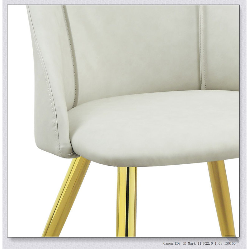 Ensemble de chaises d'appoint en cuir synthétique blanc Gaines, confortable et durable pour les intérieurs modernes, parfait pour les repas et les réceptions.