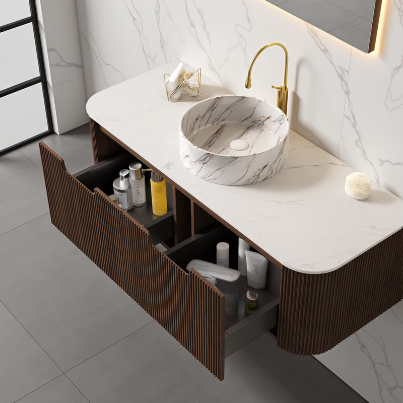 Meuble-lavabo flottant 48 po avec lavabo vasque rond en céramique ORVICA, plateau en pierre frittée d'aspect Carrare, armoire à 2 tiroirs cannelée et rangement à fermeture en douceur