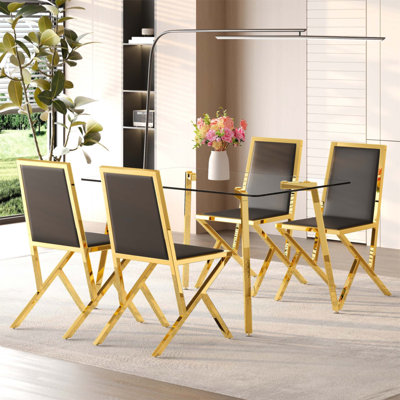 Ensemble de table à manger moderne et luxueuse en verre trempé et chaises en PU, idéal pour les espaces élégants à la maison et au bureau.