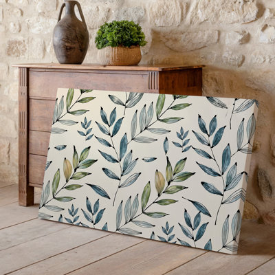 La toile crée un design de papier peint sans couture avec des motifs délicats d'art botanique dessinés à la main de feuilles élancées allongées dans une toile tendue