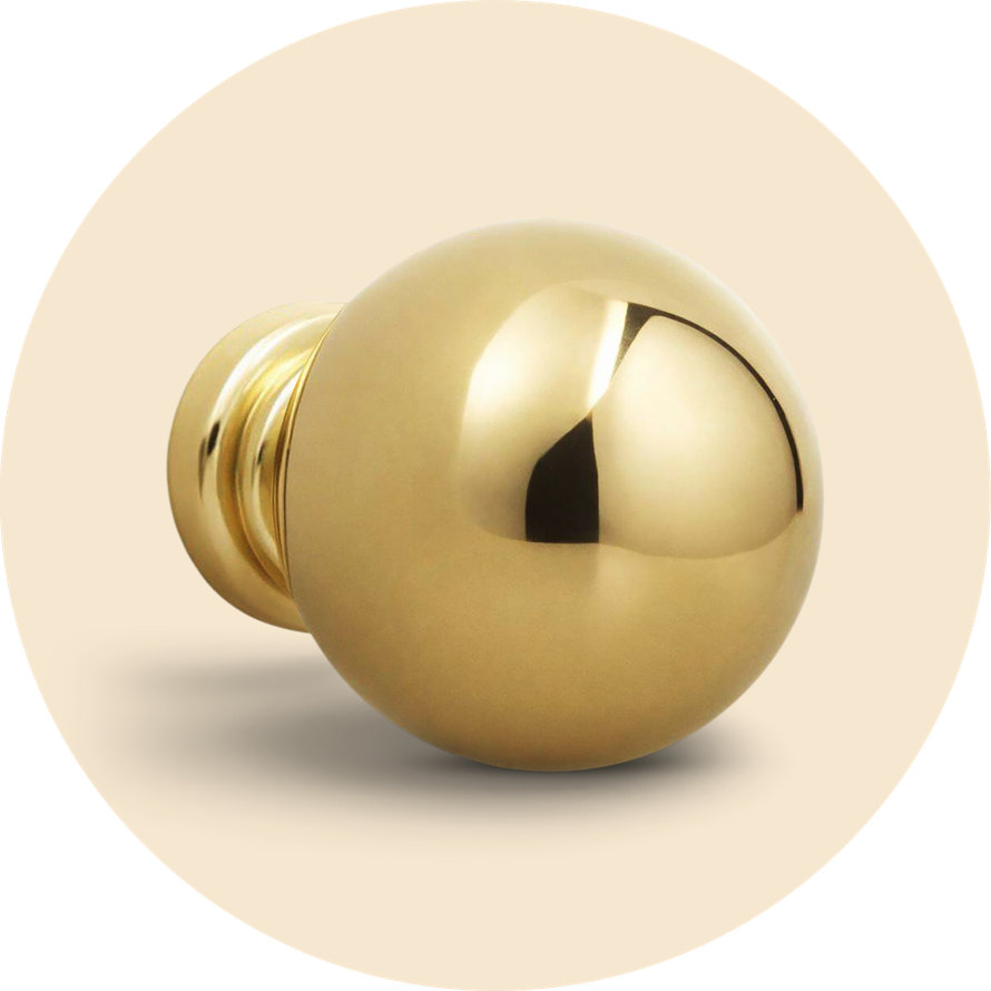 Polished brass round cabinet knob with a smooth, reflective finish.
