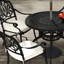 Deneise 4 - Person Patio Dining Set with Round Table , Cushions Included