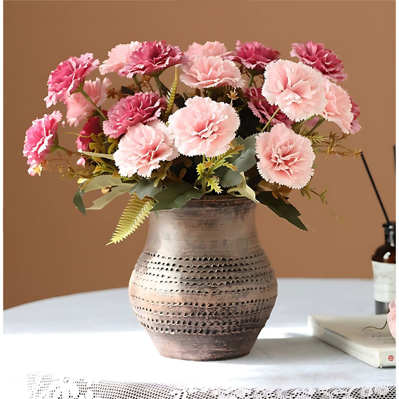Arrangement d'œillets dans un vase