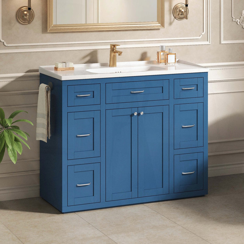 Meuble-lavabo sur pied avec lavabo en céramique, six tiroirs, tiroir central rabattable, portes doubles à fermeture amortie et porte-serviettes réversible, bleu marine