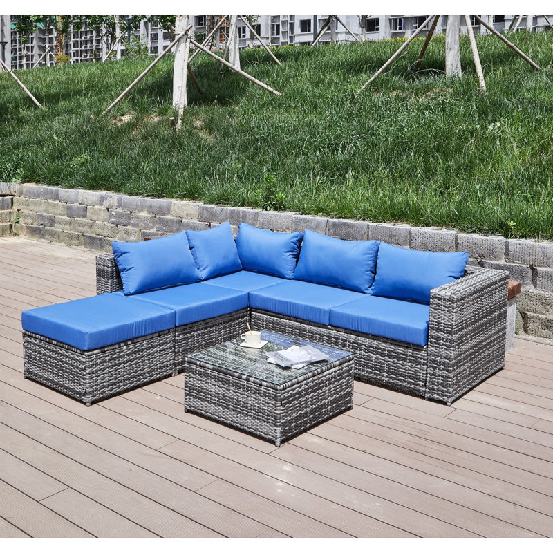 Patio élégant avec coussins. Offrez une expérience de détente en plein air. Structure en fer thermolaqué. Pe In Hand Weather Bleu + gris - coussins d'eau pour un salon confortable.