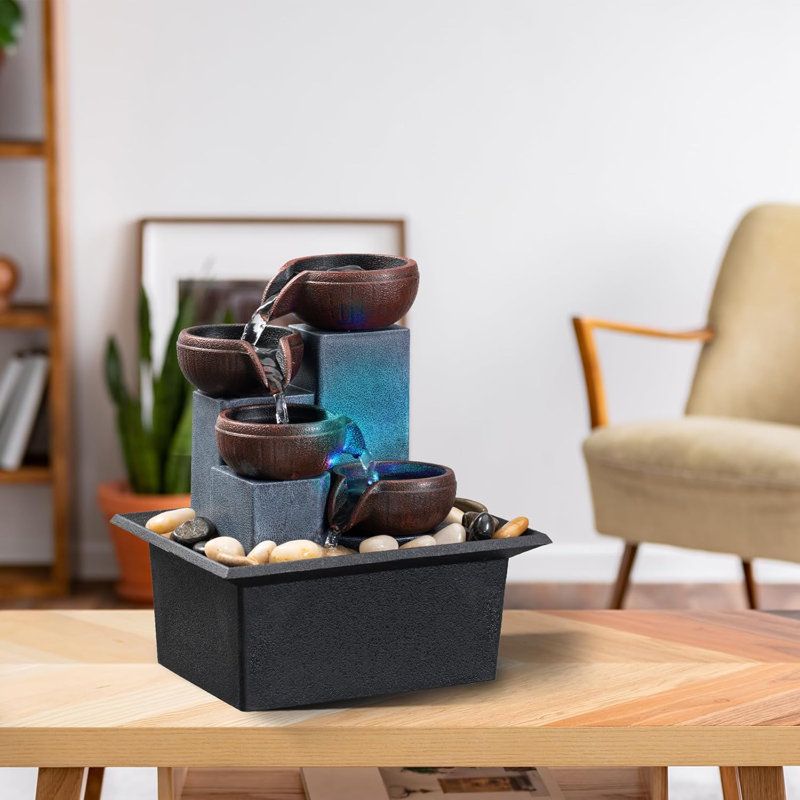 Tabletop fountain 4-tier cascade fountain includes LED colored lighting and natural rocks