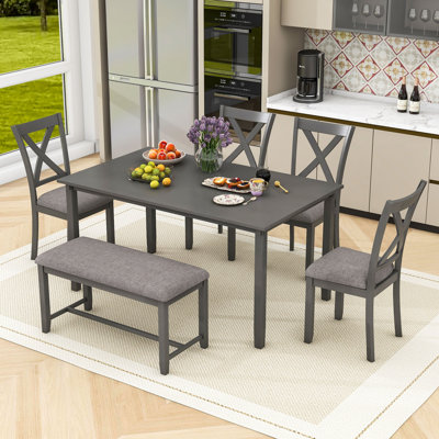 Ensemble de salle à manger 6 pièces Gilverto, table rectangulaire en bois et banc et chaises rembourrées à dossier en X