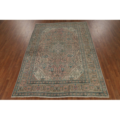 Tapis rose à motif géométrique traditionnel 7 x 9