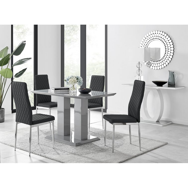 Eubanks Double Pedestal High Gloss Dining Table Set with 4 Luxury Faux Leather Dining Chairs