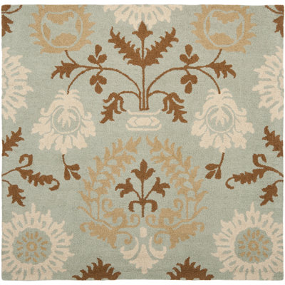 Jahiem Floral Handmade Looped Wool Blue Area Rug