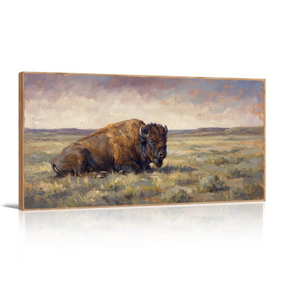 Tableau sur toile représentant un bison brun couché dans une plaine herbeuse