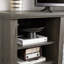 Meuble télé gris avec décoration en fausses pierres empilées et grand rangement pour téléviseur de 75 po dans la pièce Element