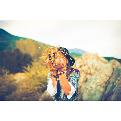 Girl Blowing Confetti by South_Agency