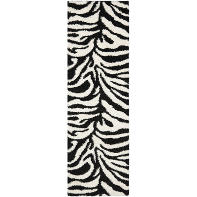 Braylee Animal Print Area Rug