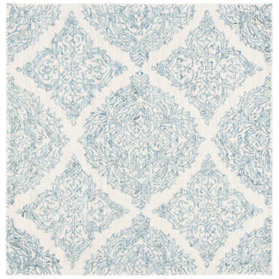 Tapis ivoire / bleu en laine touffeté à la main Hewett