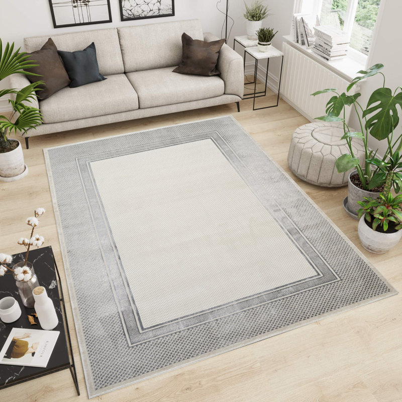 Tapis gris / crème à motif géométrique de la collection Omari