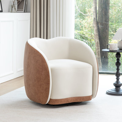 Fauteuil demi-tonneau pivotant en velours Aastha