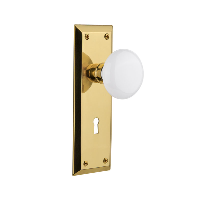 New York Plate with Decorative Keyhole and White Porcelain Door Knob, Polished Brass, 2-3/4”