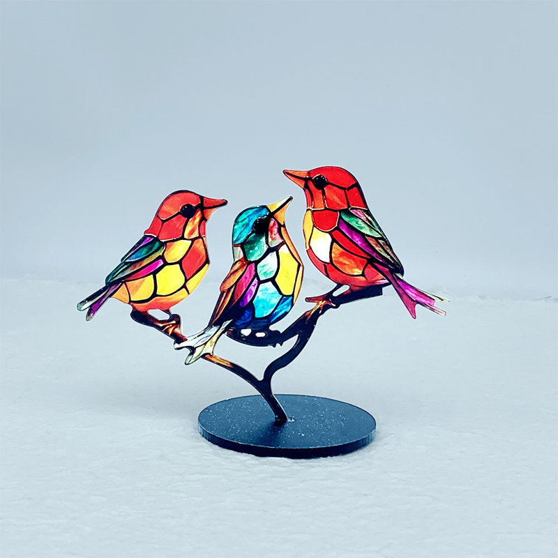 Figurine d'oiseau en acrylique sur une branche