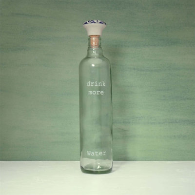 Elegant Glass Water Bottle with Ceramic Stopper - 750ML, Perfect for Daily Hydration and Kitchen Display.