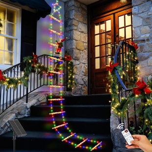 https://assets.wfcdn.com/im/60303239/resize-h310-w310%5Ecompr-r85/2596/259638784/jasmond-984-ft-tall-solar-christmas-decoration-ladder-lights-with-santa-claus-lighted-display.jpg