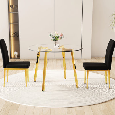 Table ronde moderne en verre transparent, pieds en métal en forme de doré 7, chaises sans accoudoirs en velours noir avec grille, fauteuils visuels avec attrait matelassé et confortable pour 2 sièges