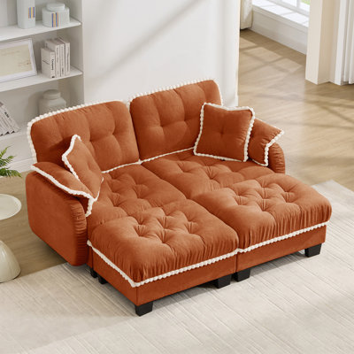 Canapé en chenille avec repose-pieds et coussins