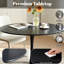 Une table de salle à manger ronde de style luxueux et noire, équipée d'une élégante base en métal en forme de tulipe et d'un plateau en panneau de fibres à densité moyenne de 31,5 pouces, présente un style médiéval moderne dans son ensemble. It