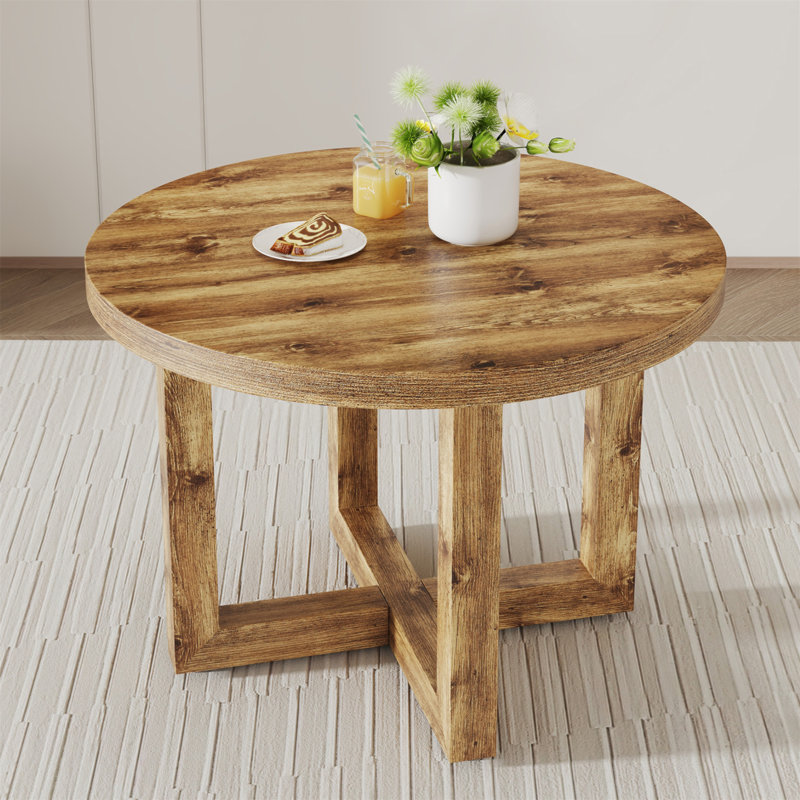 Une table de salle à manger circulaire moderne et pratique. Fabriqué en bois aggloméré et en bois.