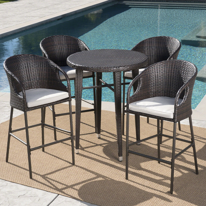 Bargnare 4 - Person Wicker Patio Dining Set with Round Table , Cushions Included