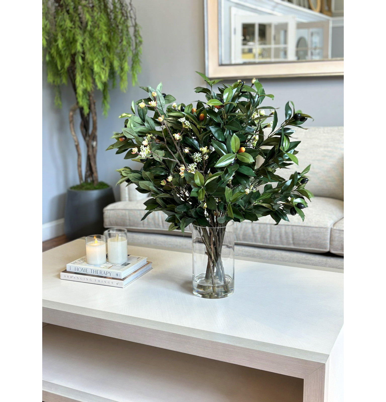 Olive Branches mixed with Blossoms Arranged in Glass Vase