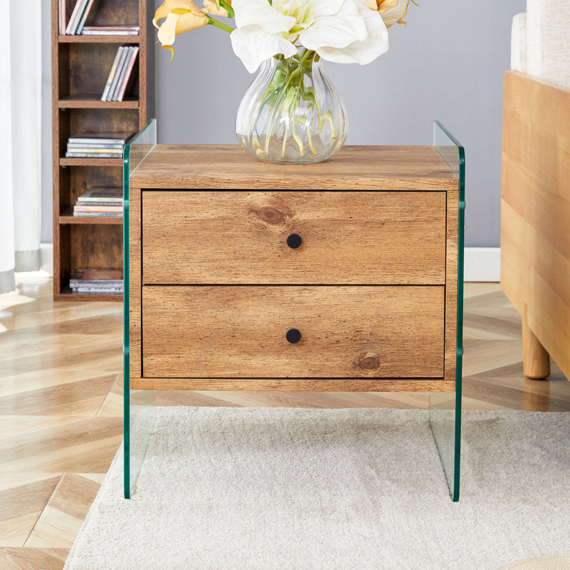 Double-Drawer Bedside Table. The Board Surface Is MDF With Wood Grain Sticker, And Both Sides Are Transparent Tempered Glass. The Design Is Simple And Elegant, With Excellent Storage Functions.
