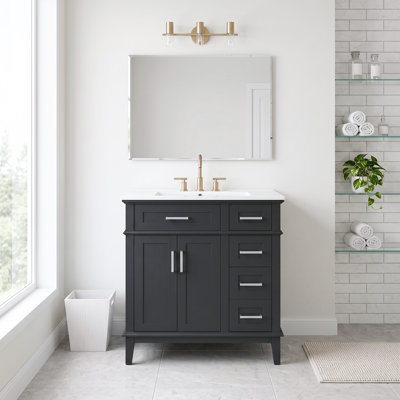 Meuble-lavabo standard autoportant de 76 cm (30 po) en bois massif et MDF, noir, avec lavabo en céramique, portes à fermeture amortie et tiroir profond. Robinetterie non incluse.
