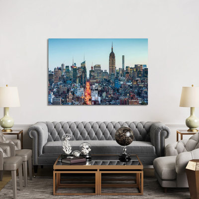 Manhattan Skyline With Empire State Building At Dusk by Jan Becke - Wrapped Canvas Print