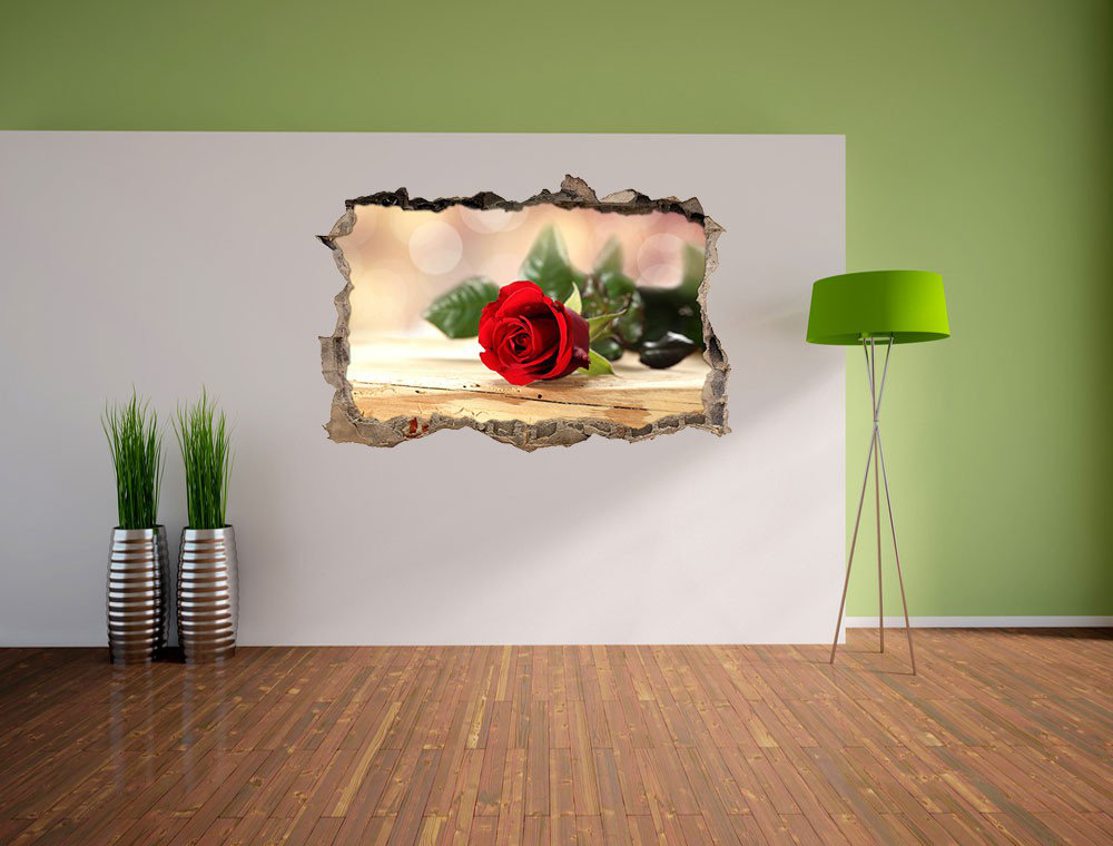 Wandaufkleber Beautiful Red Roses on a Wooden Table