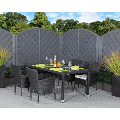 Finn 4 - Person Patio Dining Set with Rectangular Table , Cushions Included