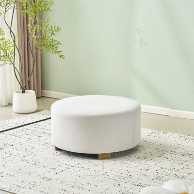 Tissu moderne blanc rond avec pieds en bois, simple et polyvalent pour un usage domestique, repose-pieds relaxant confortable