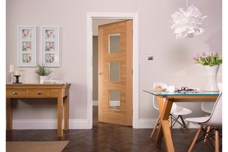 modern glam office with a natural wood door that has white casing trim