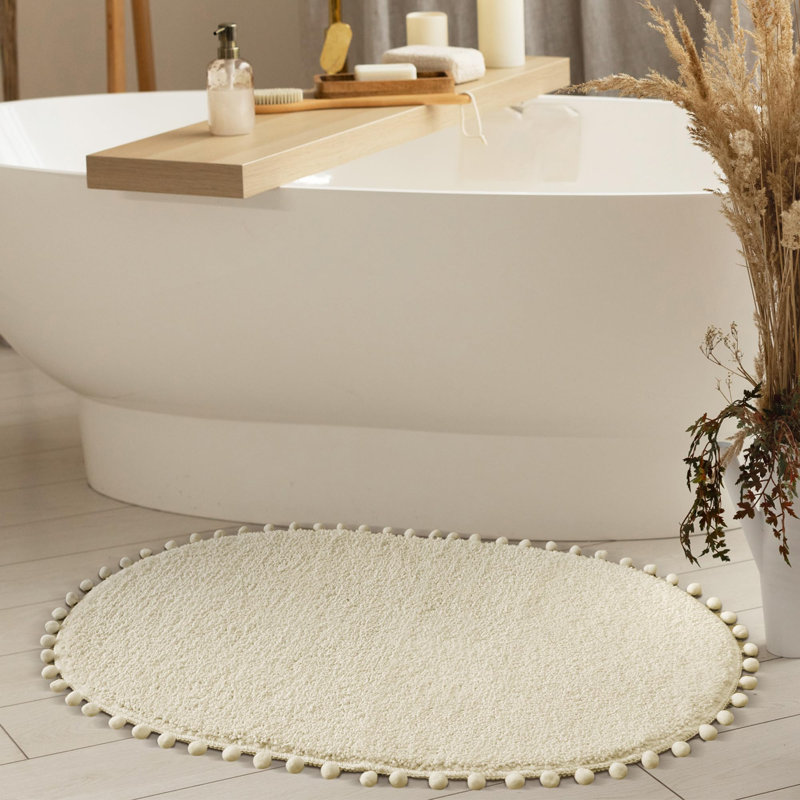 Yirddeo Bath Mat Oval Rug With Pom, Boho Rugs For Bedroom And Bathroom With Non Slip, Single- 30" L x 20" W, Cream