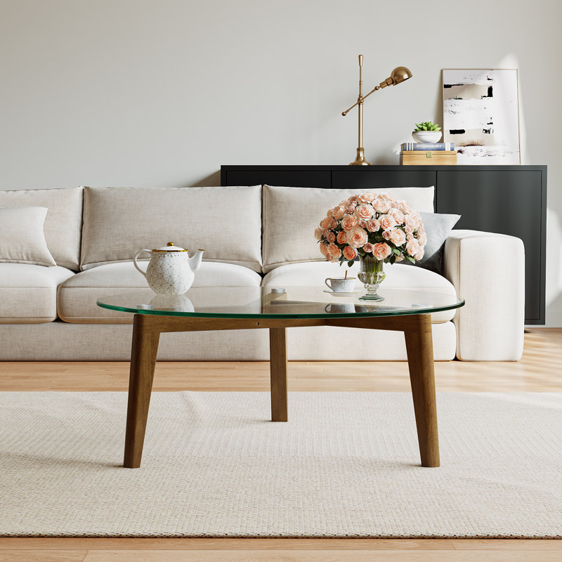 Table basse avec plateau en verre et structure en bois massif