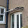 Canofix 100cm W x 65cm D Polycarbonate Clear/Light Bronze Cover Retractable Door / Window Awning