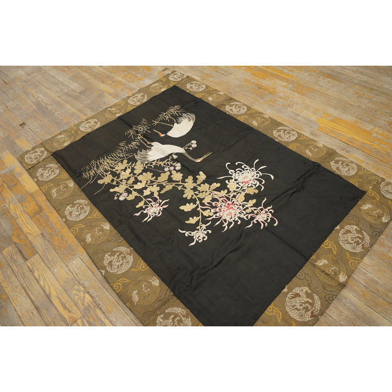 Tapis noué à motif floral antique