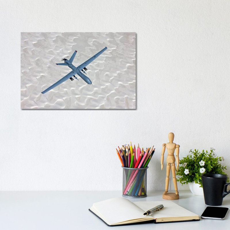 An MQ-9 Reaper Flies A Training Mission Over Southern New Mexico by HIGH-G Productions - Wrapped Canvas Print