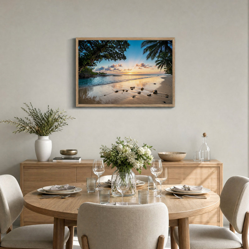 Tableau sur toile représentant un coucher de soleil tropical sur une plage avec des palmiers et des rochers
