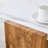 Harmonia 31" Pentagonal Coffee Table with Marble-Effect Top & Triangular Wood Base