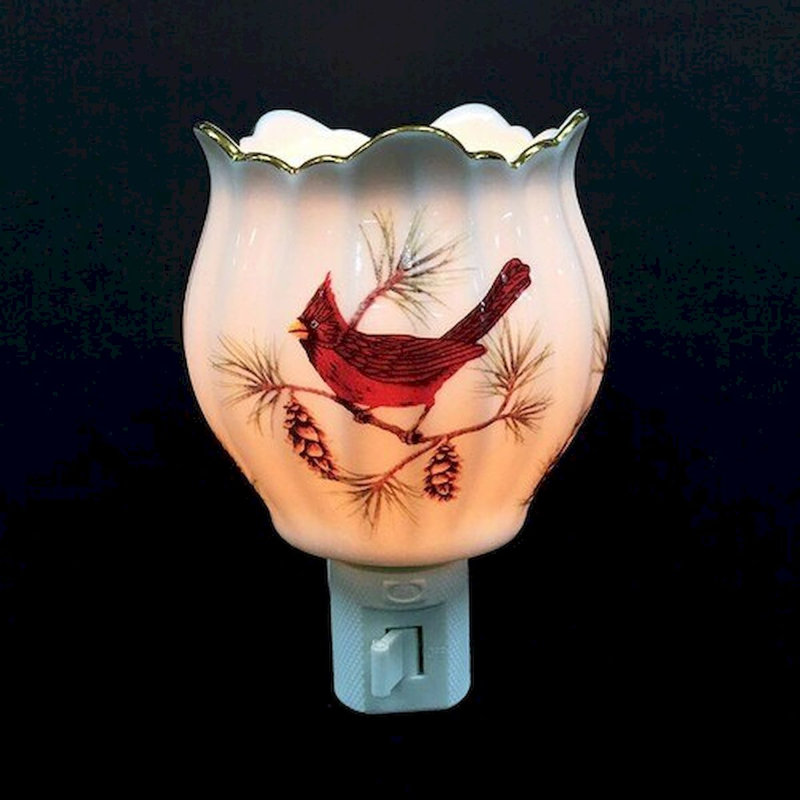 Veilleuse en forme de cardinal sur une branche de tulipe